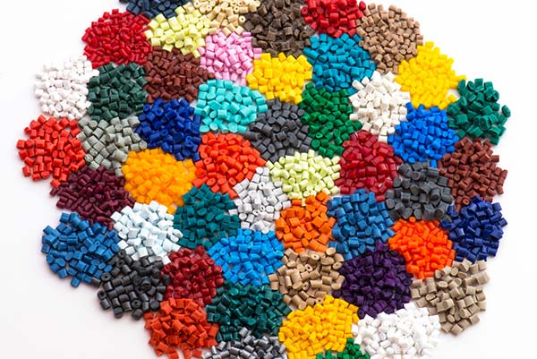 small plastic pellets in lots of different custom colors