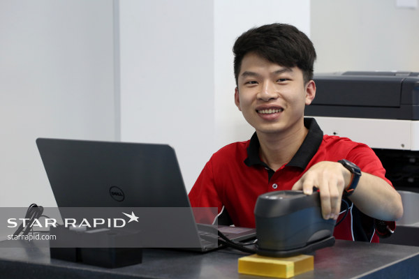 Star Rapid employee smiling at work