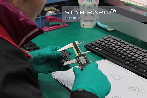 Star Rapid Employee measuring parts