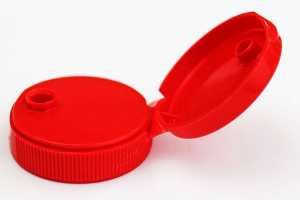 An image of a red polypropylene bottle cap, showing the live hinge detail.