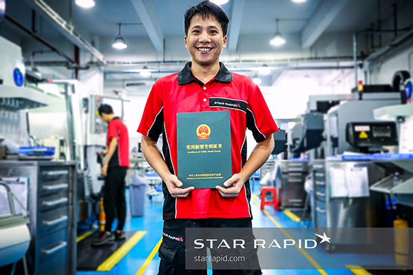 Star Rapid machinist holding patent certification