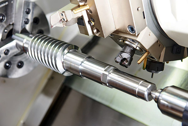 CNC part on a horizontal turning center with live tooling