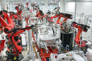 Tesla cars being assembled on an automated line