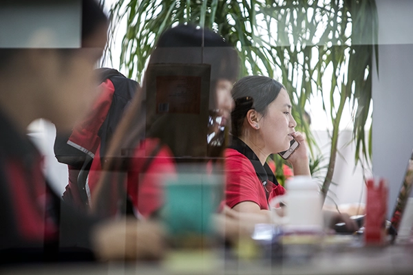 Asian woman working at a business desk