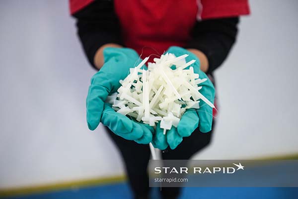 Handful of small plastic molded parts