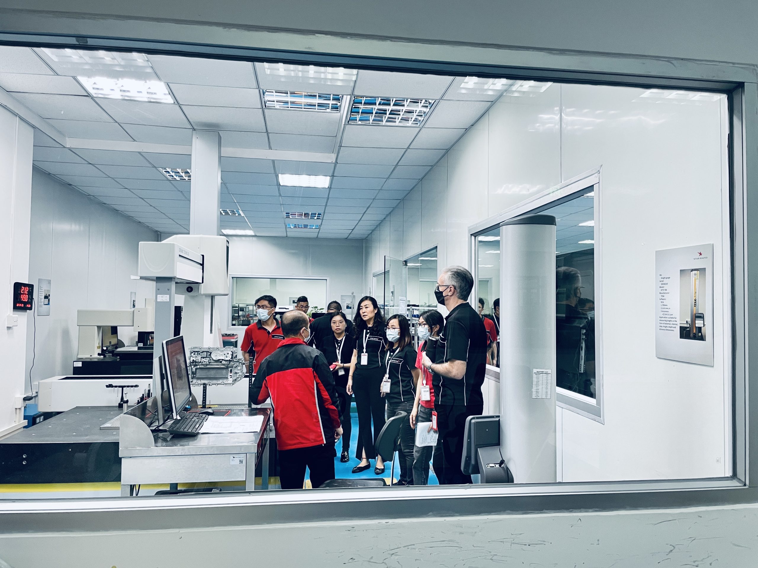 Inspection Room Check A team gathering inside of a factory building